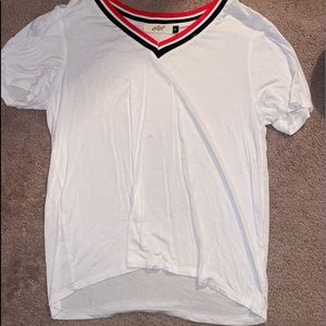 white t-shirt with black and red collar